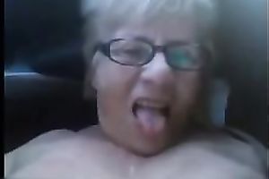 My aged short-haired slutwife plays with her shaved slit in a car