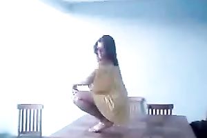 Seductive Hispanic playgirl is shaking her arse in a lewd manner