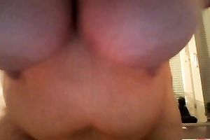 Fat slut is licking her massive pillowy love melons with excitement