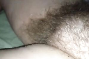 Rubbing my wife's hirsute cunt in front of a camera