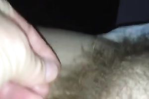 Rubbing my wife's hirsute cunt in front of a camera