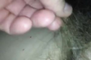 Rubbing my wife's hirsute cunt in front of a camera