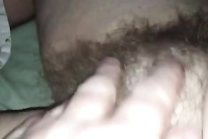 Rubbing my wife's hirsute cunt in front of a camera