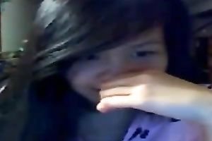 Playful Asian hottie flashes her gorgeous breasts on web camera