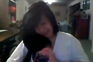 Playful Asian hottie flashes her gorgeous breasts on web camera