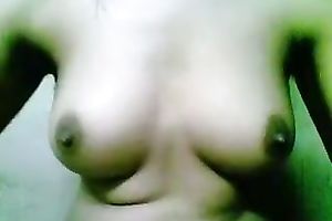 Webcam solo act with a woman showing her bumpers and rubbing her cookie