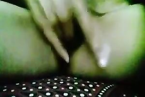 Webcam solo act with a woman showing her bumpers and rubbing her cookie