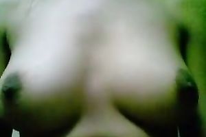 Webcam solo act with a woman showing her bumpers and rubbing her cookie