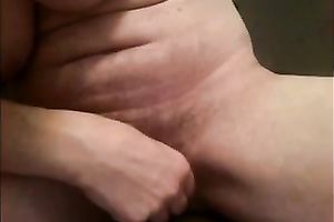 Amateur milf plays with her massive clitoris in front of a webcam