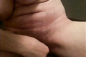 Amateur milf plays with her massive clitoris in front of a webcam