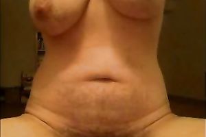 Amateur milf plays with her massive clitoris in front of a webcam