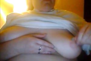 Chunky camwhore is licking her swollen teats for me