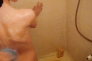 Brunette cutie fingers her fur pie in advance of taking a shower