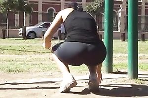 My hot fit GF, wearing legging, takes exercises outdoors