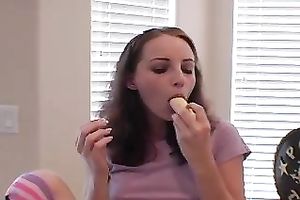 She eats banana and teases camera with gentle bites and licking