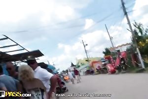 Blonde with saggy breasts fingers her twat in the field