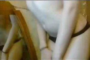 Hot white blond skank flashes her booty in dark pants