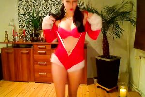 My playful girlfriend wearing santa clause outfit undresses in front of a camera