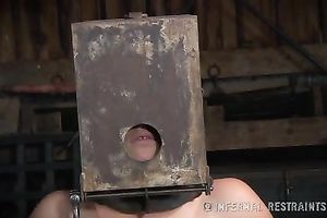 Desirable girl wearing iron head box receives her cookie toyed