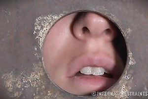 Desirable girl wearing iron head box receives her cookie toyed