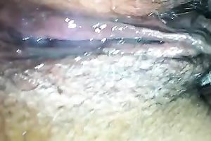 Amateur wench fingers her dark unshaved love tunnel in close up video