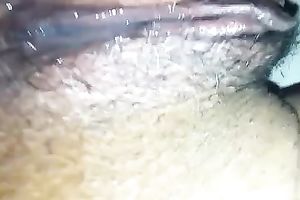 Amateur wench fingers her dark unshaved love tunnel in close up video