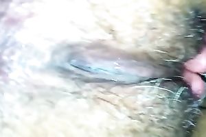 Amateur wench fingers her dark unshaved love tunnel in close up video