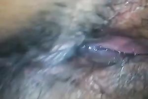 Amateur wench fingers her dark unshaved love tunnel in close up video