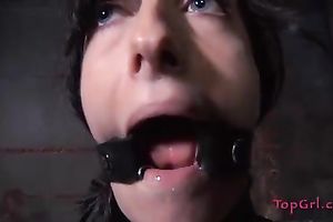 Kinky dark brown with merry pantoons is fastened to a wooden pole for punishment