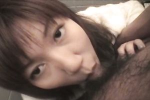 Asian hussy sucks a dong in a WC and enjoys rear banging