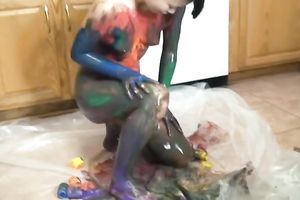 Amateur Asian hottie smears her body with paint in the kitchen