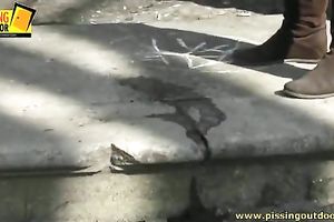 Cute brunette hair sweetheart with avid mind urinates on the sidewalk