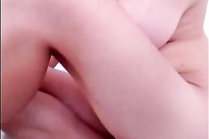 Busty chick moans sweetly during the time that fingering her palpitating slit