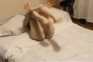 Trashy nympho bonks herself with her sex tool and shows what fisting is all about