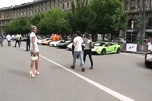 Outdoor scene with a sizzling golden-haired walking in her high heels