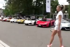 Outdoor scene with a sizzling golden-haired walking in her high heels