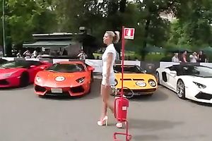 Outdoor scene with a sizzling golden-haired walking in her high heels