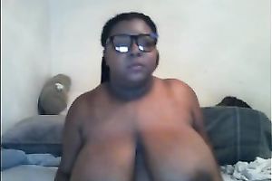 Thick ebony doxy in glasses shows off her massive wobblers and gazoo