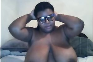 Thick ebony doxy in glasses shows off her massive wobblers and gazoo