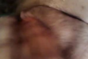 Entertaining myself by fingering my rock hard bushy slit indoors