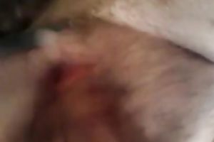 Entertaining myself by fingering my rock hard bushy slit indoors