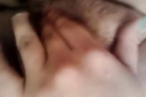 Entertaining myself by fingering my rock hard bushy slit indoors