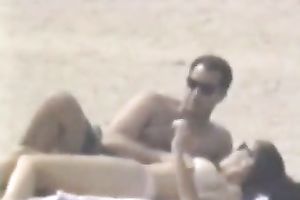 Hidden livecam scene with a pair making love on a beach