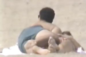 Hidden livecam scene with a pair making love on a beach