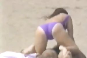 Hidden livecam scene with a pair making love on a beach