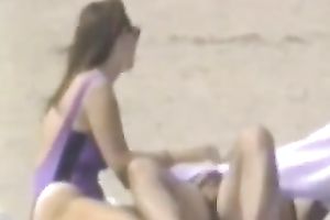 Hidden livecam scene with a pair making love on a beach
