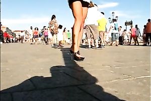 Hot honey in the town center walking in high heel shoes
