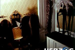 Petite dark brown rides hard ramrod on the ottoman with her extremely curly cookie