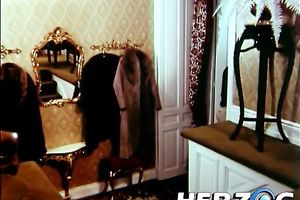 Petite dark brown rides hard ramrod on the ottoman with her extremely curly cookie