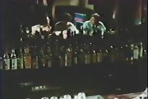 Retro harlots dance in a club and show their oral-stimulation skills